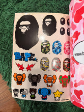 Load image into Gallery viewer, BAPE - Hello Kitty x KAWS Pink Camo Magazine Ver.1.1 - Brand New Sealed (Super Rare)
